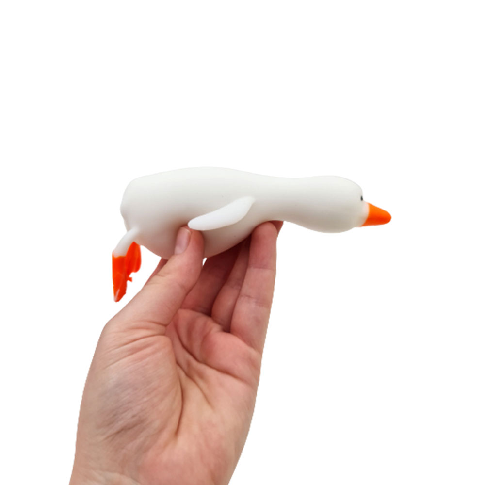فیجت-ضد-استرس-مدل-اردک-خوابیده-سفید-در-دست